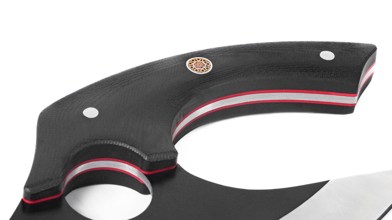 White-background product study, raking macro across the handle lamination