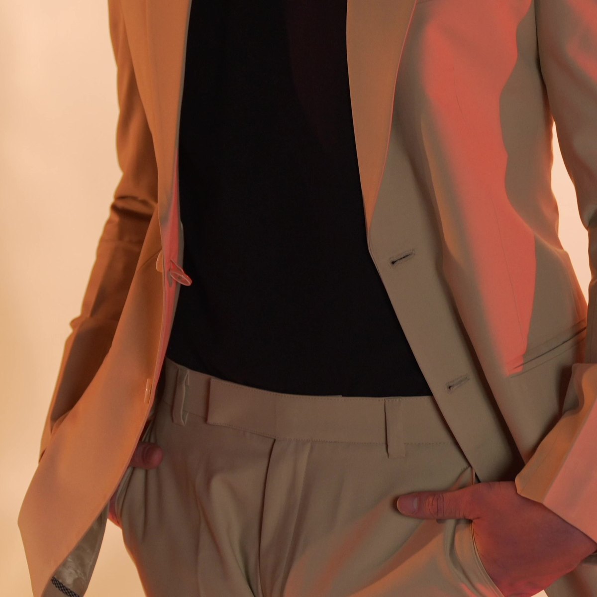 Hands at the pockets, the tailoring read close