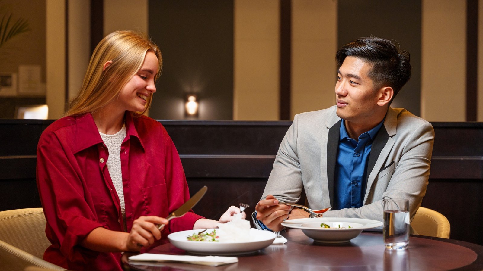 A two-top over dinner in the banquette
